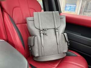 Gucci GG Embossed Leather Backpack in Grey